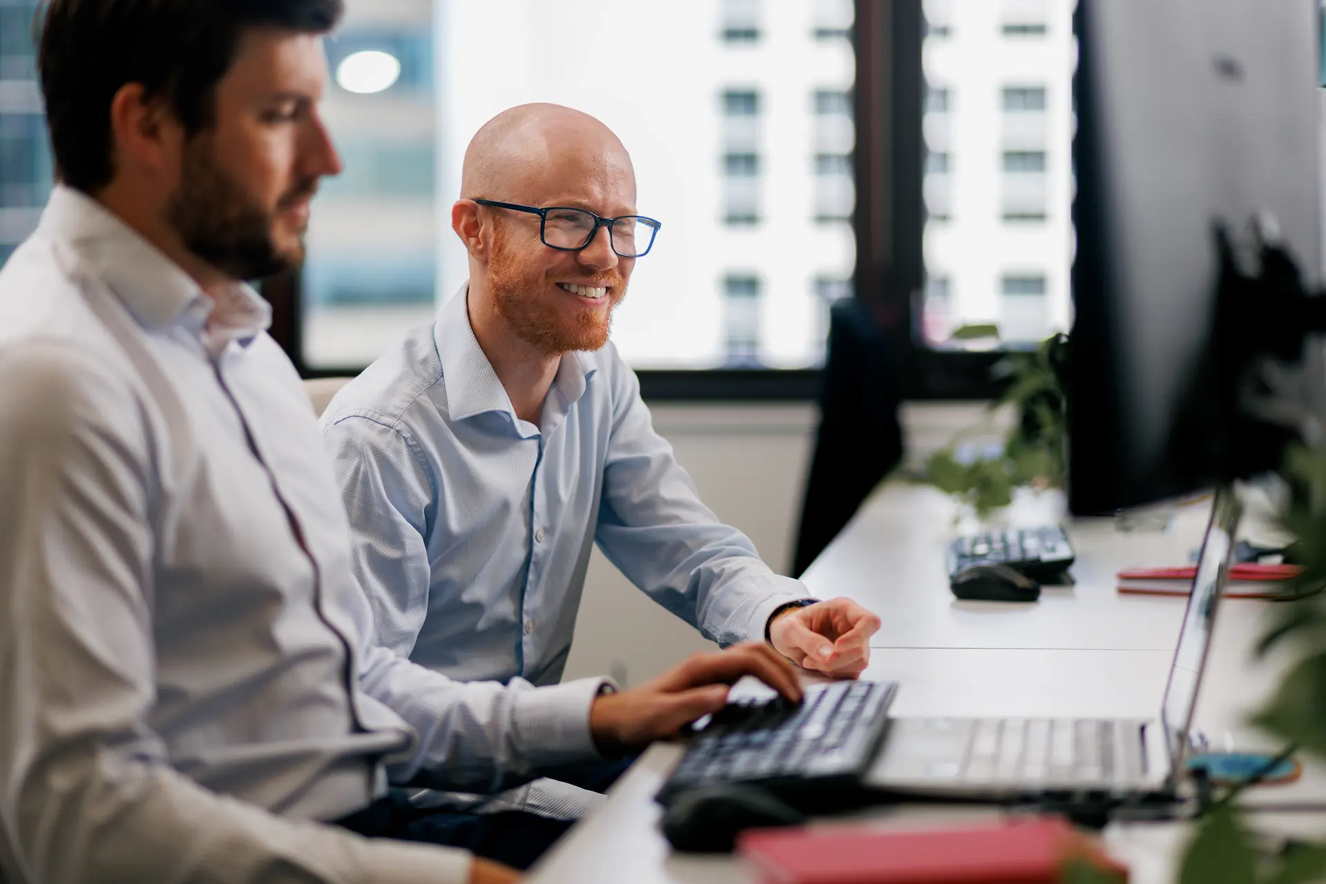 Colleague working together at a desk