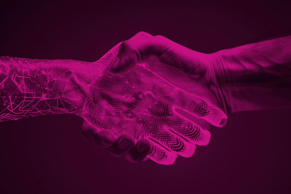 AI hand shaking human hand