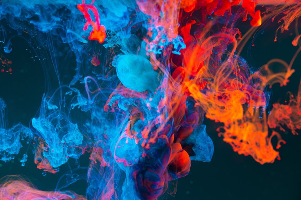 An abstract image of blue and orange smoke